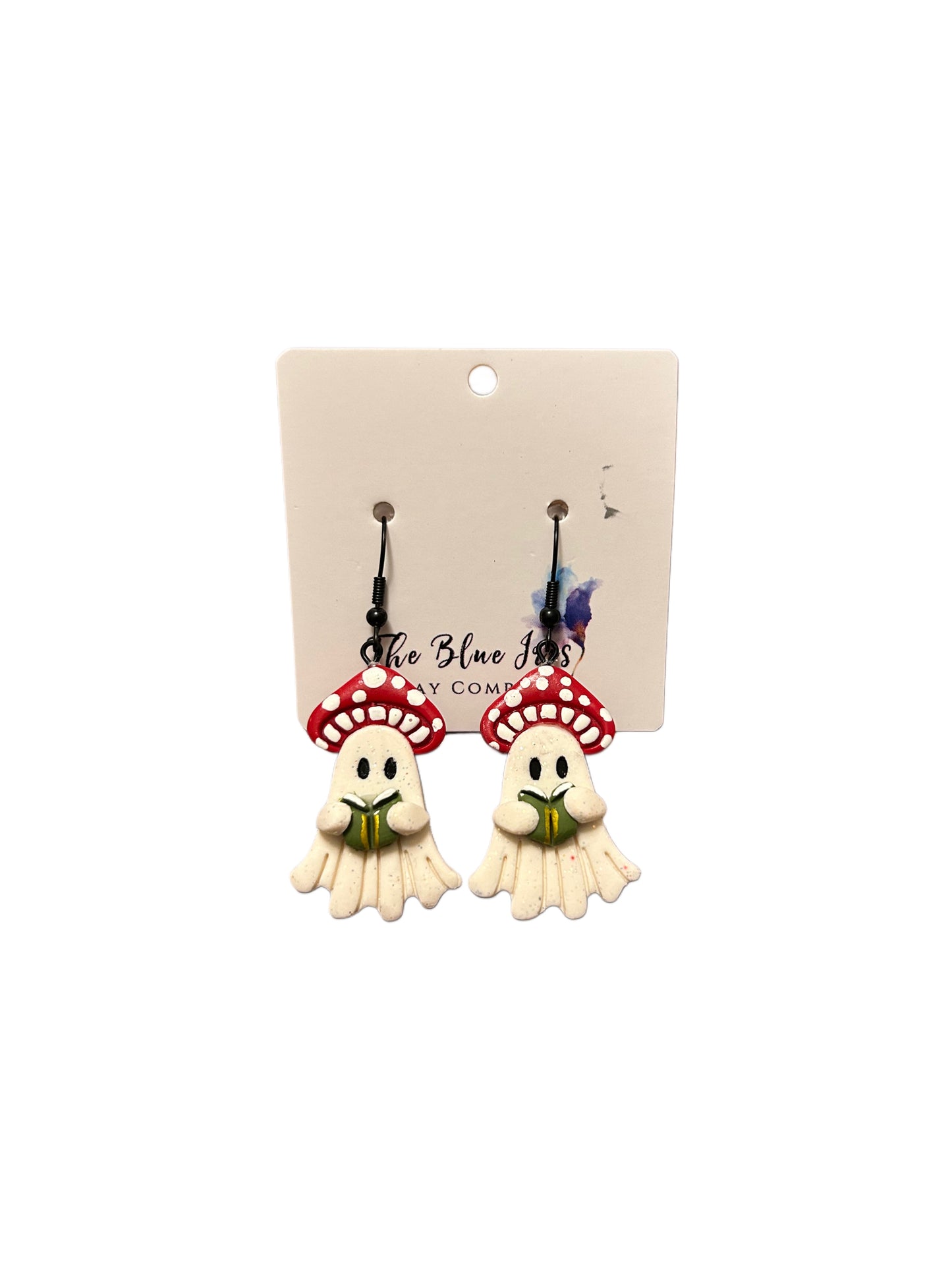 Spooky-cute polymer clay earrings with ghosts under mushroom hats holding a book