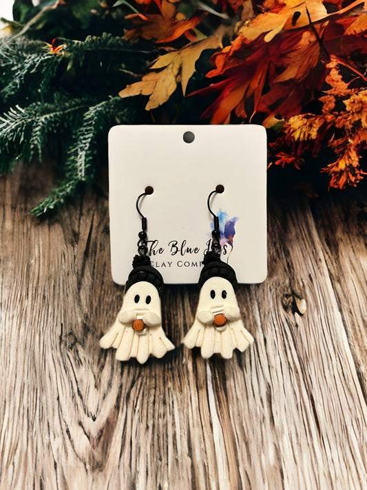 Handmade polymer clay earrings shaped like glittery ghosts in black winter hats holding pumpkin spice lattes