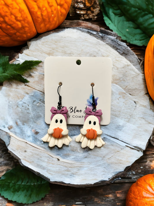 Cute handmade Halloween earrings featuring tiny ghost figures hugging pumpkins, lightweight and safe for sensitive ears