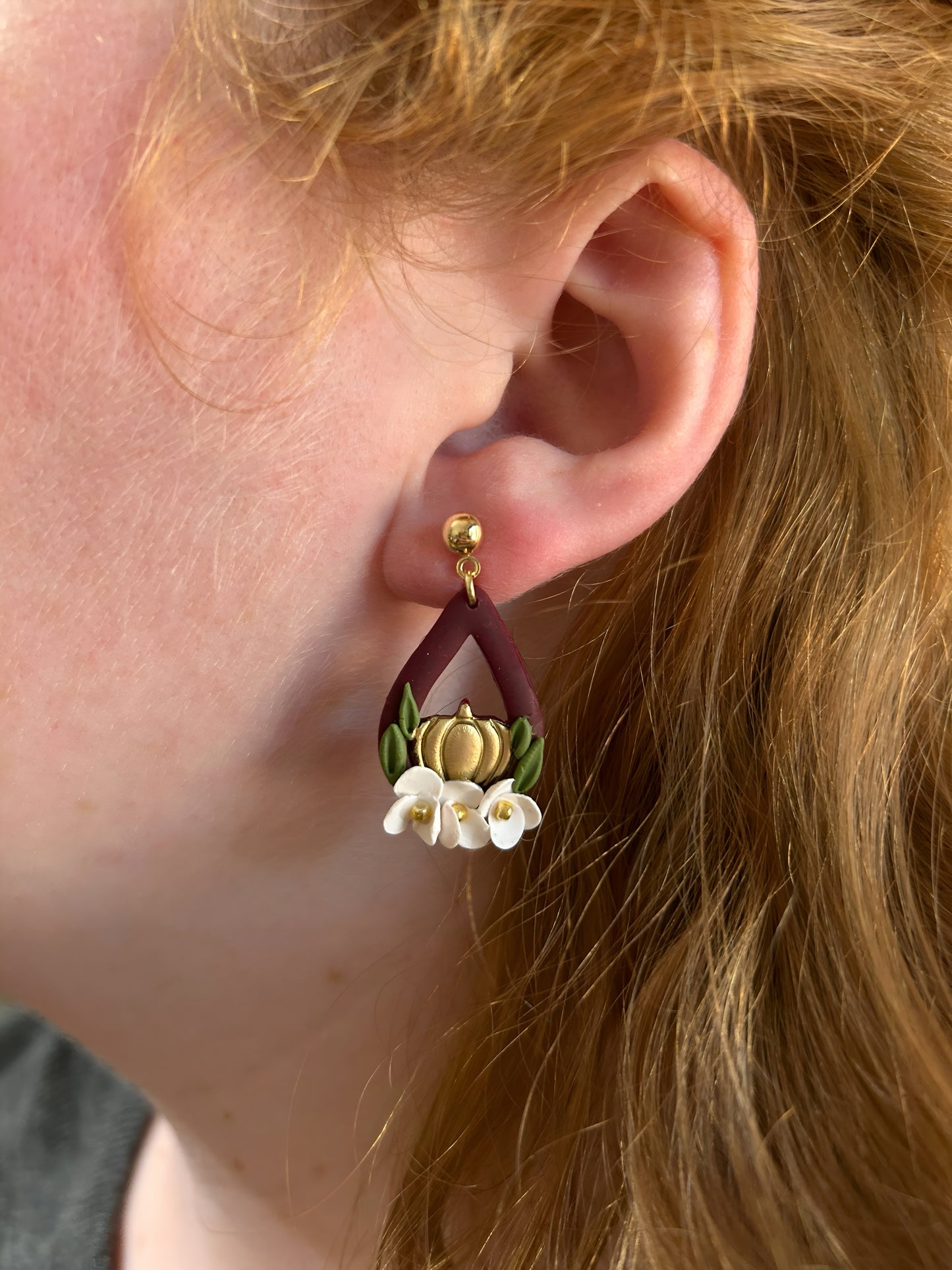 Handmade burgundy teardrop polymer clay earrings with pumpkin and flowers