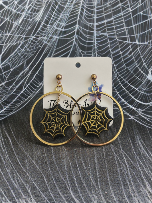 Handcrafted black polymer clay spider web earrings with gold accents, lightweight dangle jewelry for Halloween or gothic style