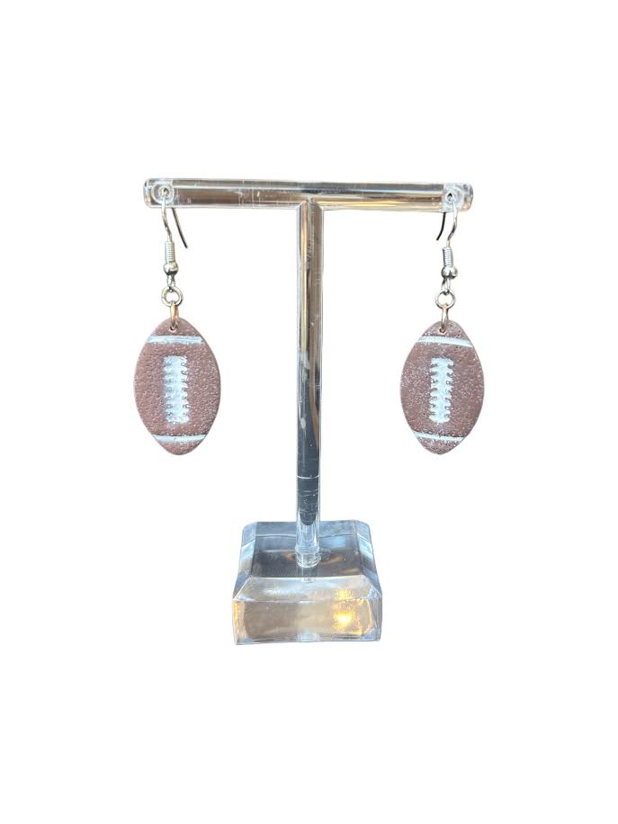 Handcrafted polymer clay earrings shaped like footballs, lightweight and comfortable for everyday wear