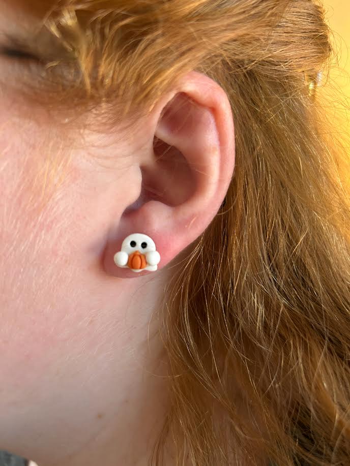 Handmade polymer clay ghost holding pumpkin stud earrings for Halloween
