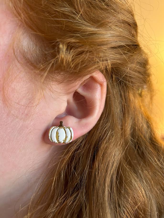 Fall-inspired pumpkin stud earrings with gold leaf accents, handcrafted polymer clay jewelry for women and teens