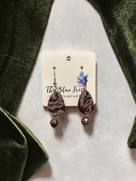 Handmade polymer clay earrings with unique shape and lace overlay look