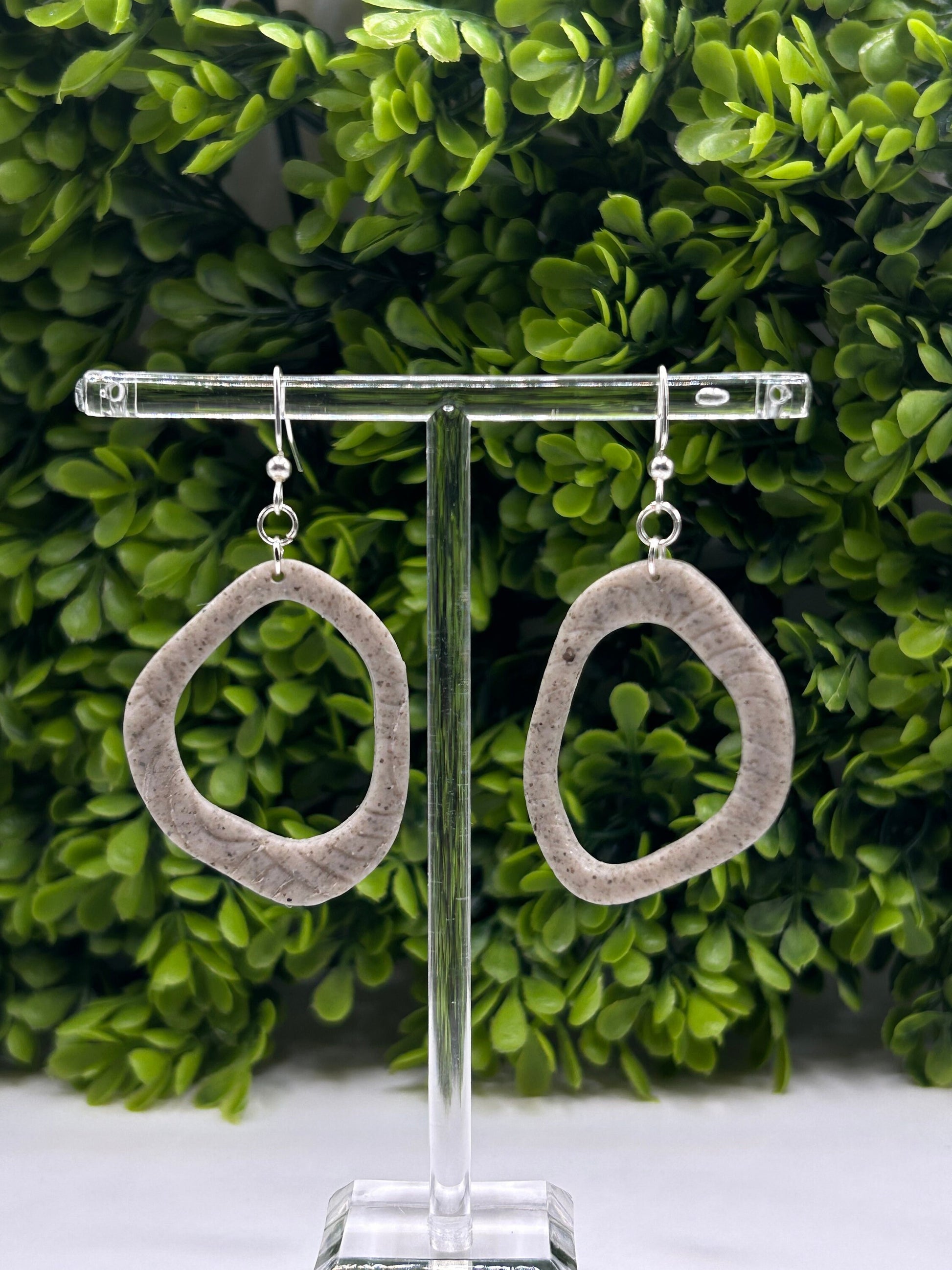 Handmade polymer clay dangle earrings with open geometric shape